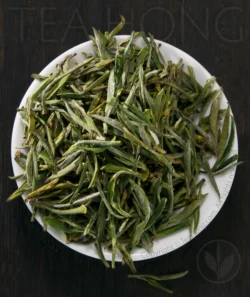 The tiny one tip and one leaf plucks of a genuine supreme quality Huangshan Maofeng green tea