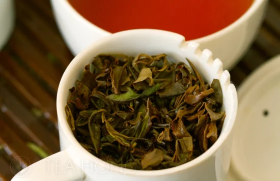 oriental beauty infused leaves in taster mug Infused tealeaves of Oriental Beauty Mystic in a tea taster's mug
