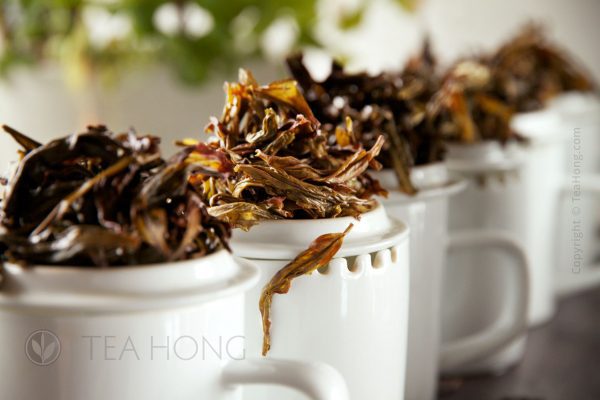 Infused leaves on tasters' mugs