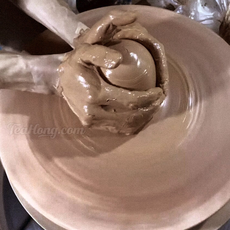 Making of Zitao teapot on a thrower's wheel