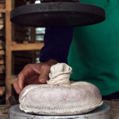 Wrapped tealeaves to be compressed into cha bing