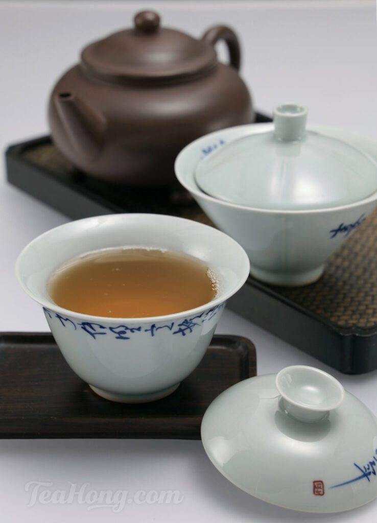 A Yixing teapot and two gaiwans