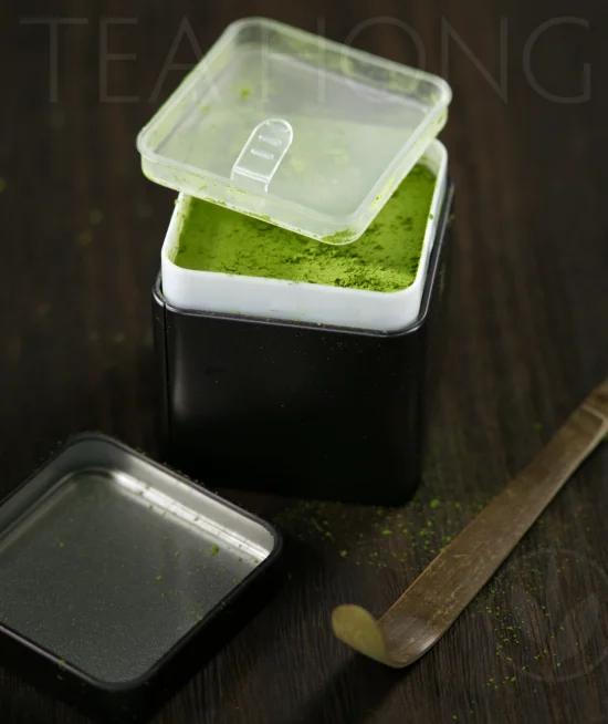 matcha tea tin open A double-lidded, double wall tea tin opens to reveal the matcha content