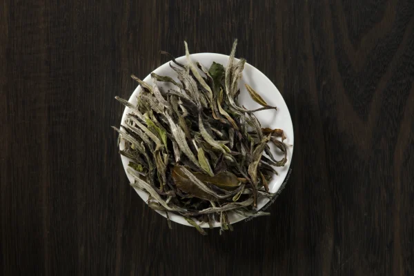 The white downy leaf shoots of White Peony Classic Floral dulled through long years of maturing