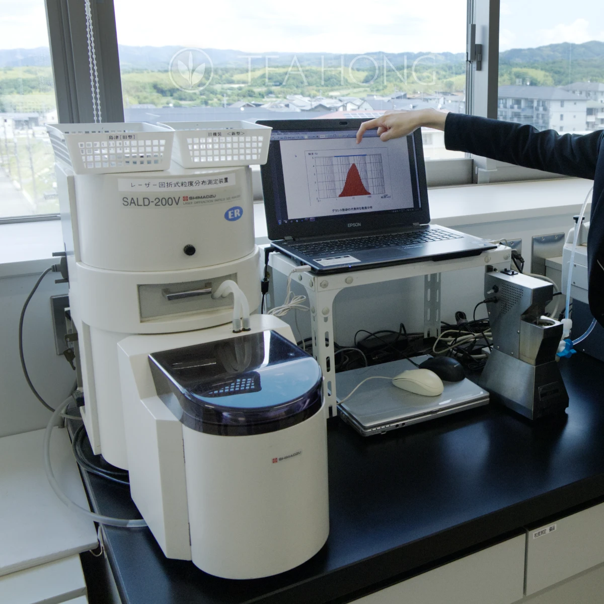 Particle size distribution monitoring set up in an office overlooking at the tea fields in Uji