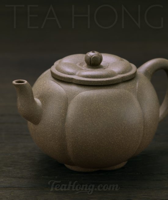 Qin Mu Yun: Plum Blossom, a Yixing green ash duan-ni teapot A Yixing teapot handcrafted by Qin Mu Yun: three-quarter front view