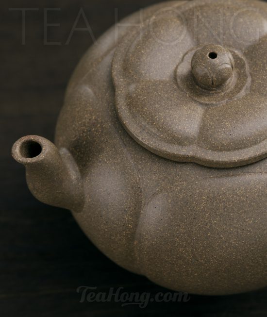 Qin Mu Yun: Plum Blossom, a Yixing green ash duan-ni teapot A Yixing teapot handcrafted by Qin Mu Yun: closeup of the spout area