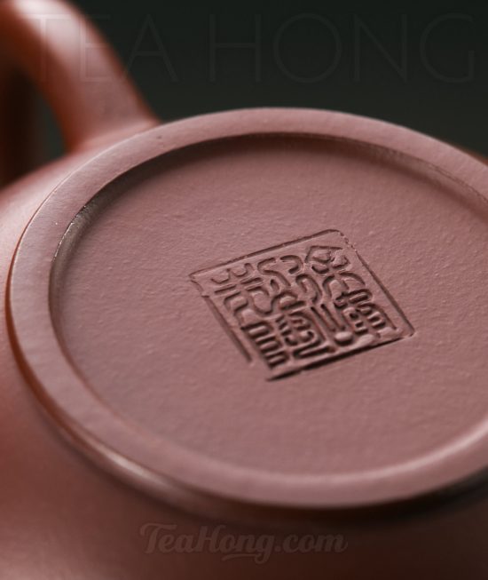 Xu Feng: Shui Ping A Yixing teapot handcrafted by Xu Feng: closeup showing the artist seal on the teapot bottom