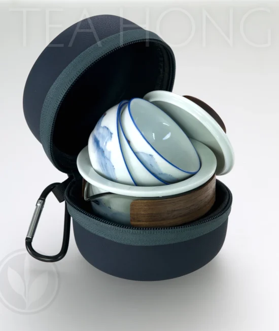 Easy Life Traveller's Tea Set in the carrying case A small carrying case zip open, showing the three cups, infuser and the glass teapot packed tightly inside