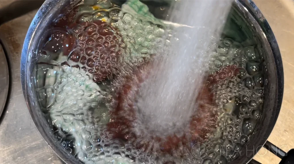 Flushing water onto a Yixing teapot
