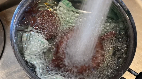 Flushing water onto a Yixing teapot