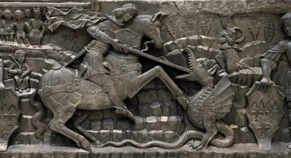 an ancient relief sculptured eade of a coffin of a royal figure in Europe