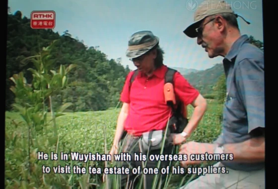 A screenshot of the RTHK TV programme of myself and a visiting client in the tea field of Wuyi